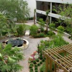 A simple garden layout with ample seating areas, soothing focal points, profuse plantings, and views from the hospital creates a benign and supportive setting.